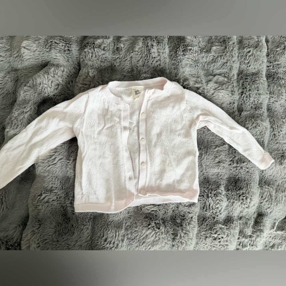Light pink cardigan size 9-12M has a faint stain
